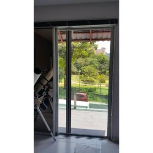 ROLLER SCREEN DOOR WITH HEAT RESISTANT MESH